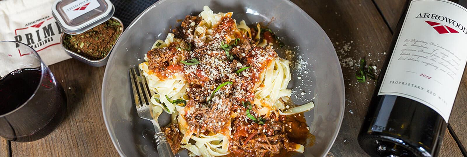 RED WINE BRAISED SHORT RIB RAGU SERVED OVER TAGLIATELLE PASTA